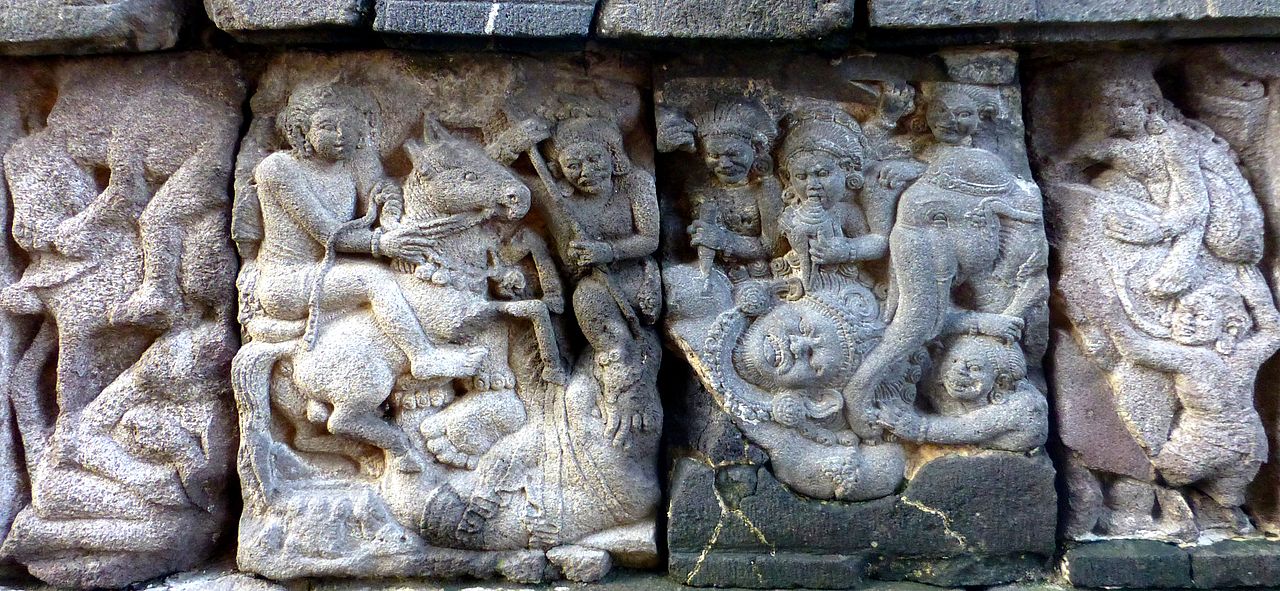 Candi_Prambanan_-_058_Defeat_of_a_Giant,_Brahma_Temple_(12042145226).jpg