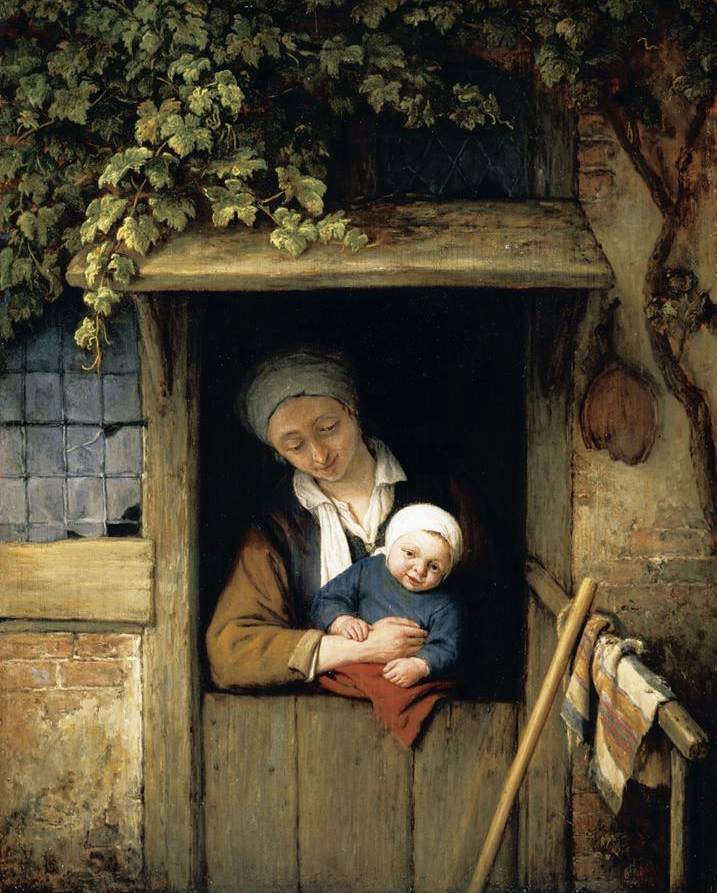 mother-holding-her-child-in-a-doorway.jpg